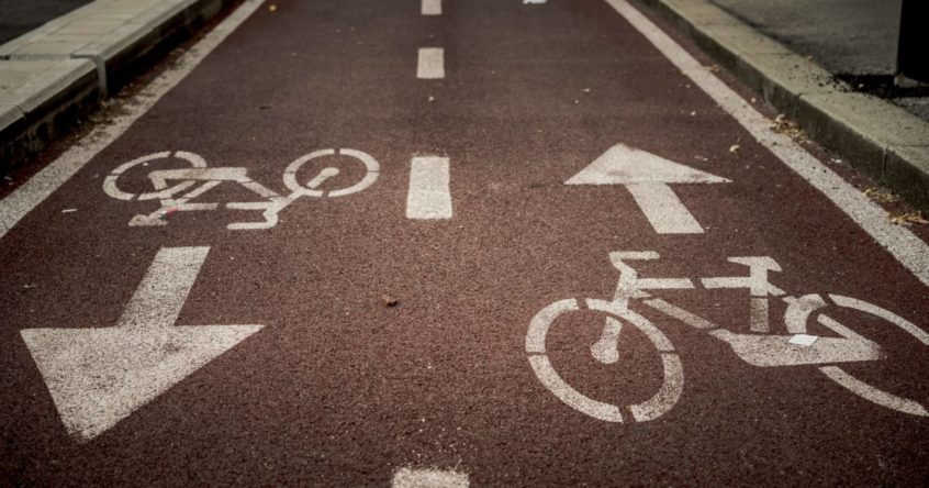 bicycle lane sign on road