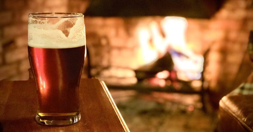 Beer by the pub fire. St Ives 2020